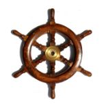 A miniature teak & brass ship's wheel, 45cms (17.75ins) diameter.