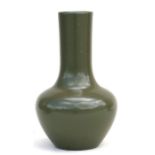 A Chinese celadon glaze vase with six character blue mark to underside, 22cms (8.5ins) high.