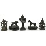 Three Indian bronze temple figures; together with a pair of Indian bronze foot scrubbers