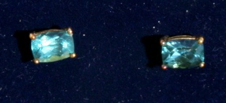 A pair of 9ct gold rectangular cut green apatite stud earrings.