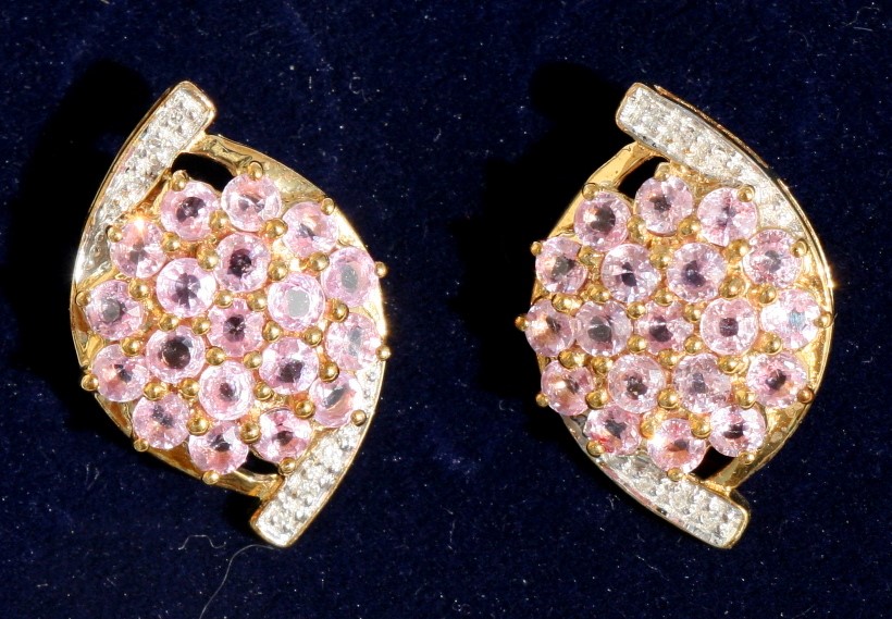 A pair of pink sapphire and diamond cluster earrings