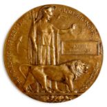 A WW1 memorial plaque or death penny named to Joseph TomlinsonCondition ReportHole drilled top