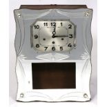 An Art Deco French cut glass fronted wall clock, the silver dial with Arabic numerals, 55cms (21.