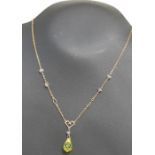 A 9ct gold necklace with crystal drop pendant.
