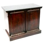 An early 19th century figured mahogany side cabinet with two doors and later marble top, on a plinth