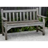 A teak garden bench, 128cms (50.5ins) wide.