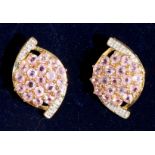 A pair of pink sapphire and diamond cluster earrings