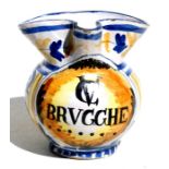 An Italian maiolica faience jug decorated with foliate scrolls and central armorial panel 'Brugghe',