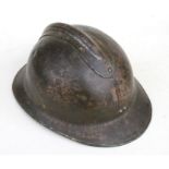 A WWII M26 French tin helmet.