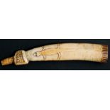 An early 20th century West African ivory oliphant horn with dot decorated mouthpiece and stylised