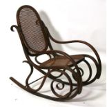 A bentwood rocking chair with caned seat and back.