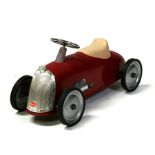 A Baghera child's ride on racing car, 84cms (33ins) wide.