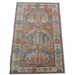 A Turkish Ushak woollen hand made rug with geometric design on a cream ground,218 by 133cms (86 by