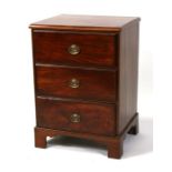 A mahogany chest of three long drawers, on bracket feet, 59cms (23.25ins) wide.