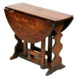 A small oak gateleg table, 61cms (24ins) wide.