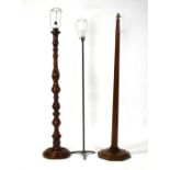 An Art Deco walnut standard lamp; together with two other standard lamps (3).
