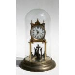 A brass Anniversary clock under a glass dome, with white enamel dial and Arabic numerals, 31cms (