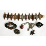 A quantity of Scottish hardstone jewellery to include a bracelet, pendant and brooches.