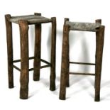 A pair of rustic wood and strung seat bar stools, possibly Irish.