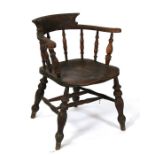 A 19th century smokers bow armchair.
