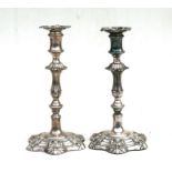 A pair of early 19th century silver plated candlesticks, 30cms (12ins) high.