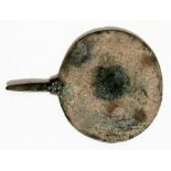 A Roman bronze hand mirror, 13cms (5ins) diameter.