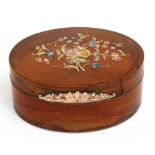 A George III oval blonde tortoiseshell box inlaid with yellow and white metal, 9cms (3.5ins) wide.