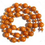 An egg yolk amber Bakelite round bead necklace, the largest bead 2cms, total weight 172g
