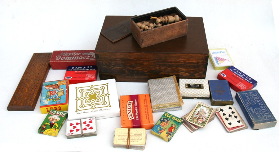 A box containing vintage games to include a part chess set.