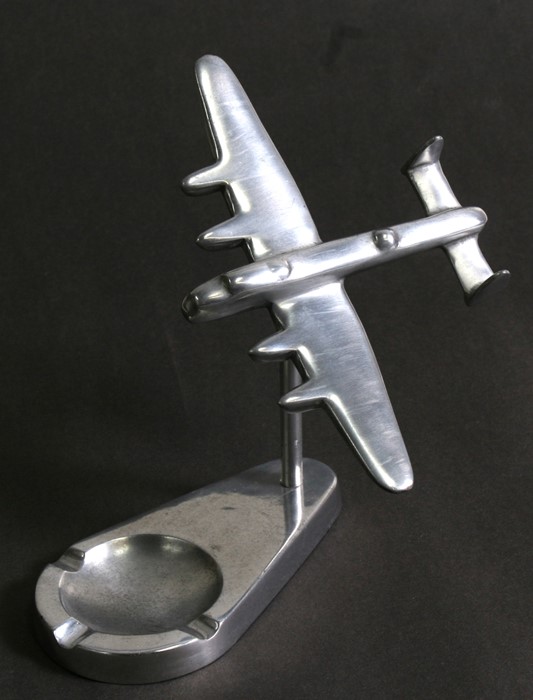 An aluminium model of the iconic Avro Lancaster mounted on its aluminium ashtray base. Wingspan