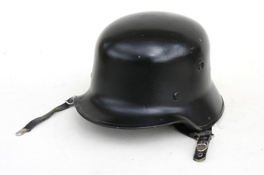 A German Vulcan fibre fireman's helmet.