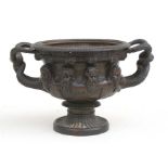 A 19th century Grand Tour style bronze copy of a Warwick vase, 12cms (4.75ins) high.