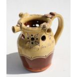A Mottoware puzzle jug - My Wits Will Give Good Ale To Sup Or Else A Wetting From This Merry Cup -