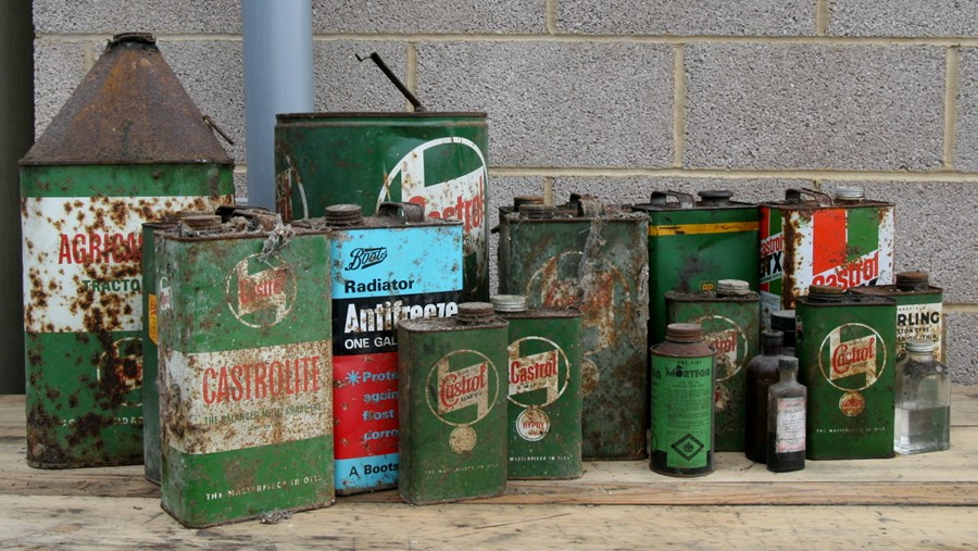 A collection of Castrol oil cans and other cans and bottles.