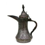 A Turkish / Islamic tinned copper dallah coffee pot, 26csm (10.25ins) high.