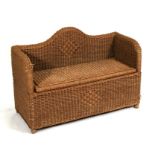 A child's rattan ottoman or sofa with lift-up seat, 93cms (36.5cms) wide.