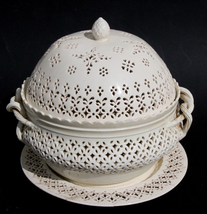 A Leeds Pottery cream ware chestnut basket, cover and stand, each piece with pierced decoration,