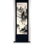 A 20th century Chinese scroll painting depicting a mountainous river scene with calligraphy and