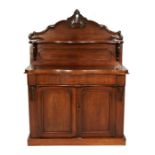 A Victorian mahogany serpentine fronted chiffonier with single frieze drawer above cupboards, on a