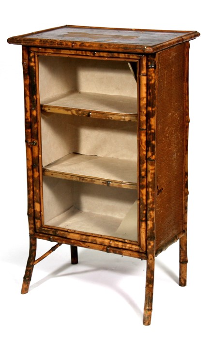A late 19th century bamboo side cabinet with single glazed door and shelved interior, 53cms (