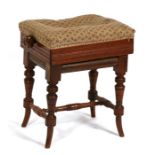 A late 19th century walnut rise and fall piano stool on ring turned supports joined by a
