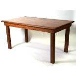 A rectangular topped pine kitchen table on square chamfered legs, 162cms (63.75ins) long.