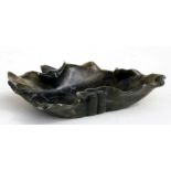 A Chinese figured green soapstone brush washer in the form of a lotus leaf, 13cms (5ins) wide.