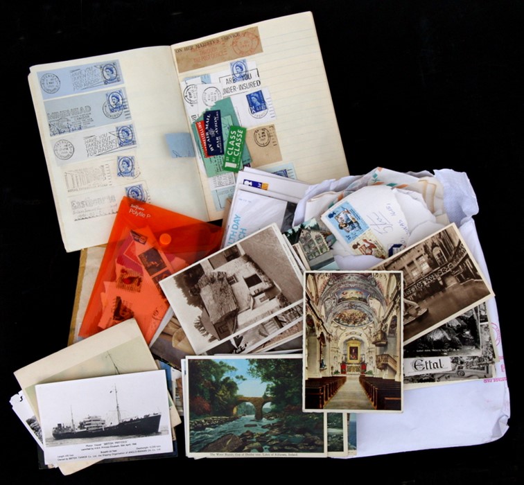 A quantity of postcards and loose stamps to include First Day covers.