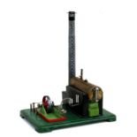 A Mamod style stationary steam engine with chimney.