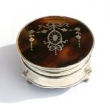 An Edwardian silver and tortoiseshell trinket box. 6cm (2.25 ins) diameter