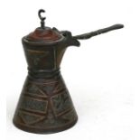 An Islamic damascene decorated coffee pot, 15cms (6ins) high.