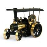 A Wilesco model of a steam tractor, 29cms (11.5ins) long.