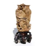 A large Chinese carved soapstone vase on stand decorated with birds and flowers, 38cms (15ins)