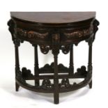 An 18th century style carved oak credence table with fold-over top, 73cms (28.25ins) wide.